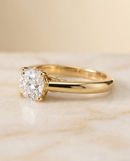 The Rio Scroll Gallery Comfort Fit Solitaire Cushion Cut Engagement Ring Setting in 18K Yellow Gold