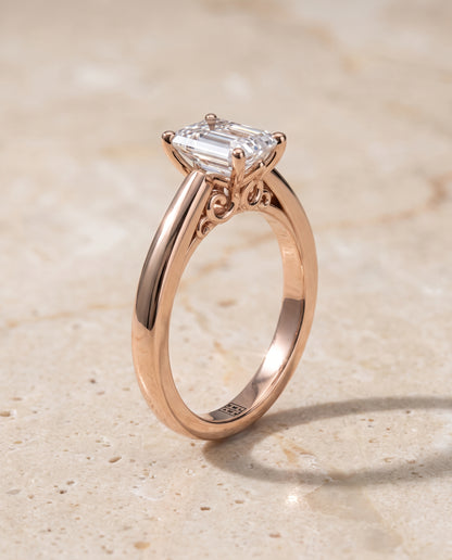 The Rio Scroll Gallery Comfort Fit Solitaire Emerald Cut Engagement Ring Setting in 14K Rose Gold