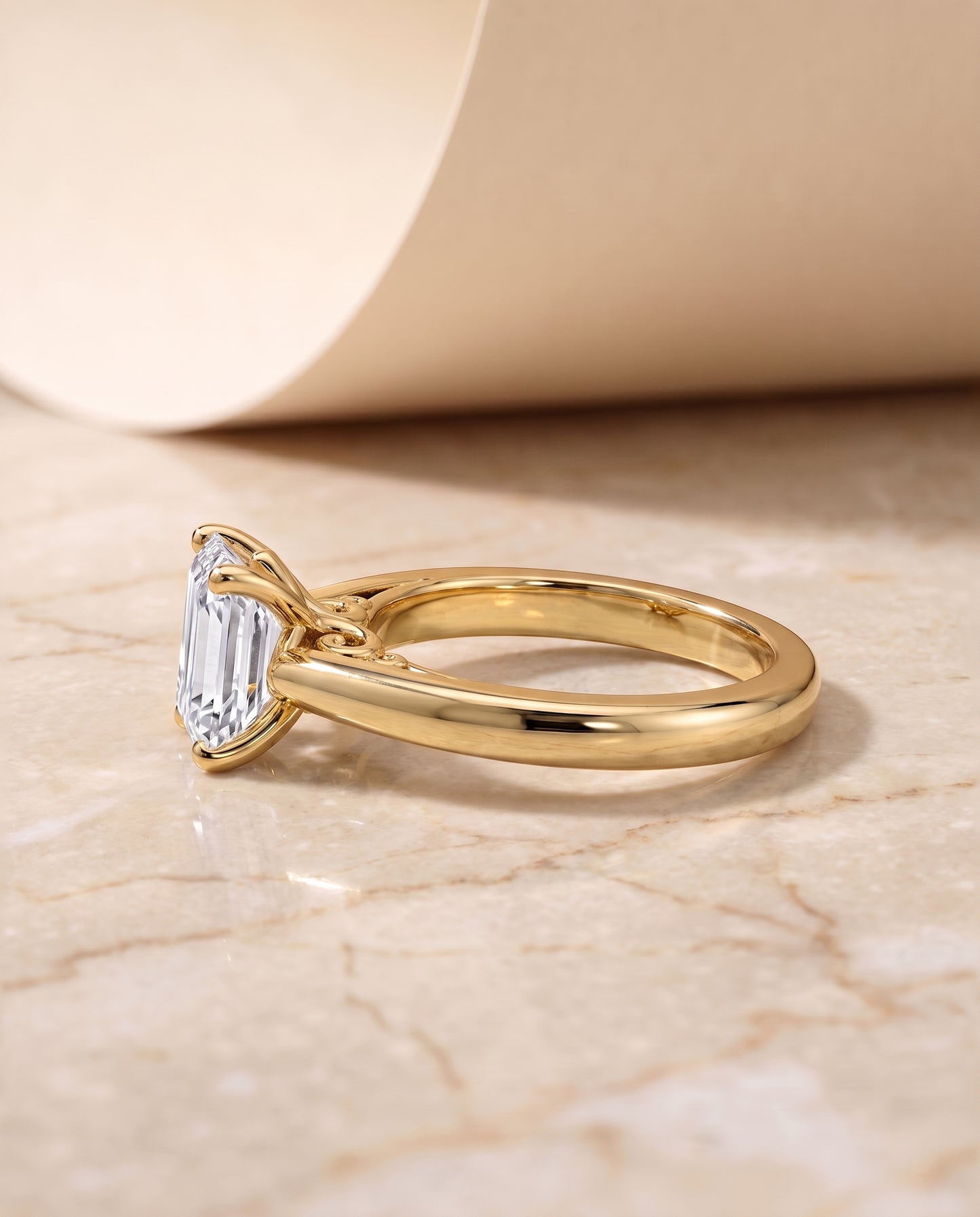 The Rio Scroll Gallery Comfort Fit Solitaire Emerald Cut Engagement Ring Setting in 18K Yellow Gold