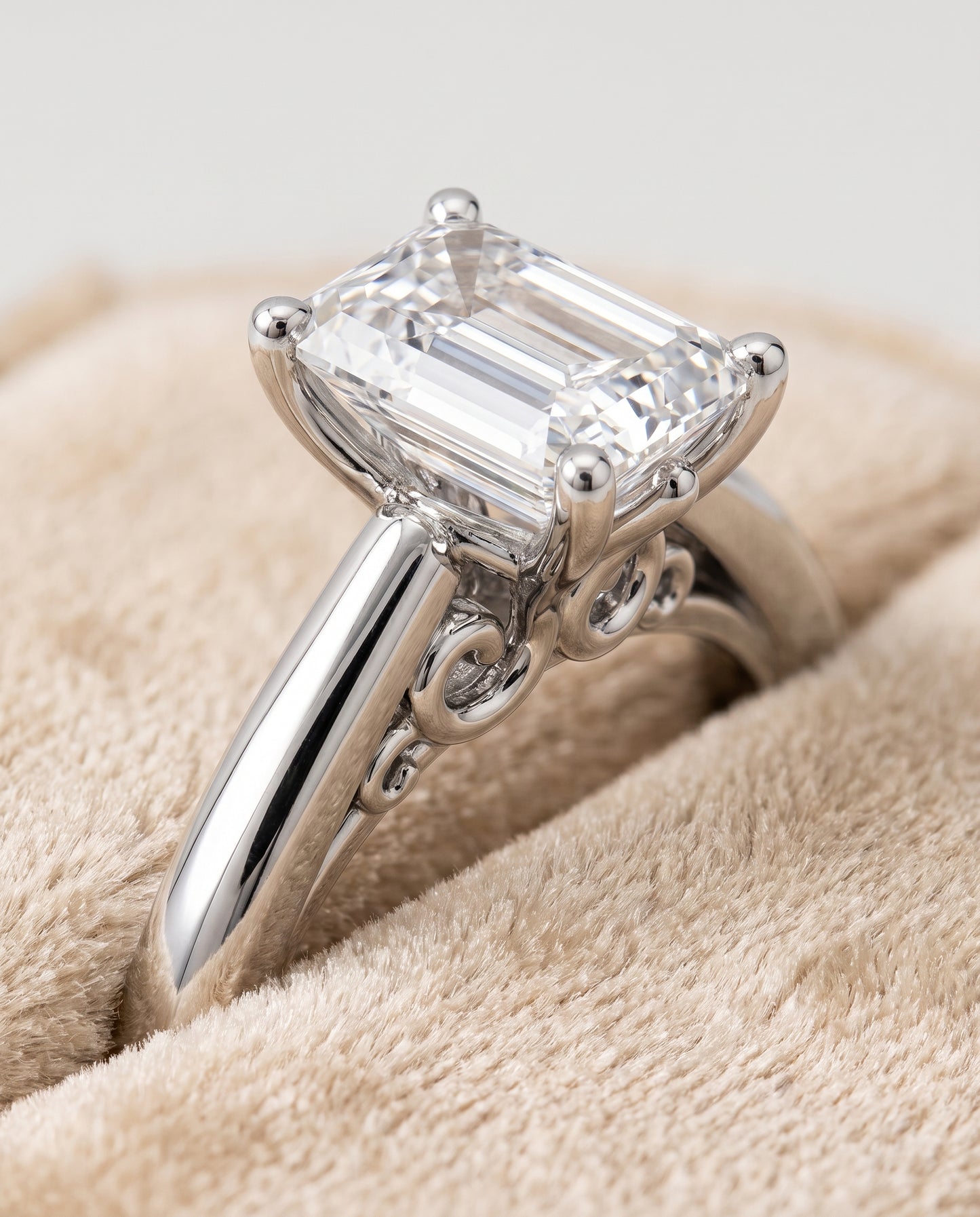 The Rio Scroll Gallery Comfort Fit Solitaire Emerald Cut Engagement Ring Setting in 18K White Gold