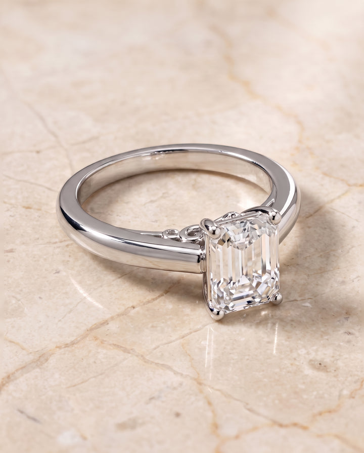 The Rio Scroll Gallery Comfort Fit Solitaire Emerald Cut Engagement Ring Setting in 18K White Gold
