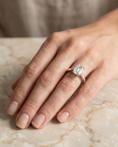 The Rio Scroll Gallery Comfort Fit Solitaire Emerald Cut Engagement Ring Setting in 18K White Gold
