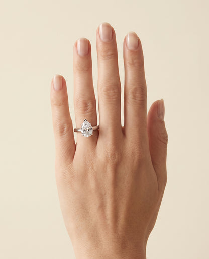 The Rio Scroll Gallery Comfort Fit Solitaire Pear Engagement Ring Setting in 18K White Gold