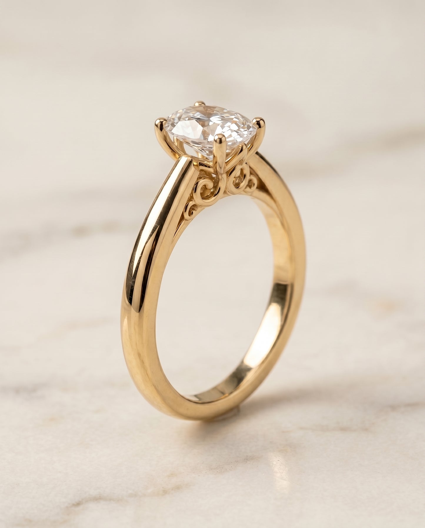 The Rio Scroll Gallery Comfort Fit Solitaire Oval Engagement Ring Setting in 18K Yellow Gold