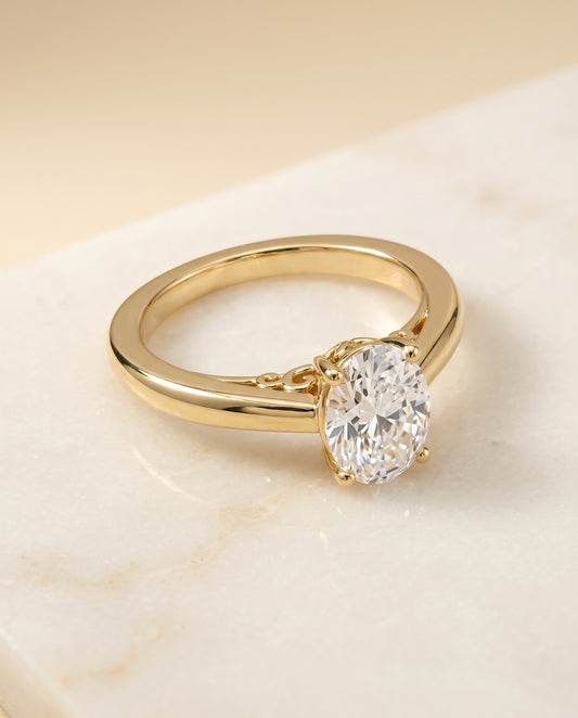 The Rio Solitaire Engagement Ring Setting for Oval Diamonds in 18K Yellow Gold