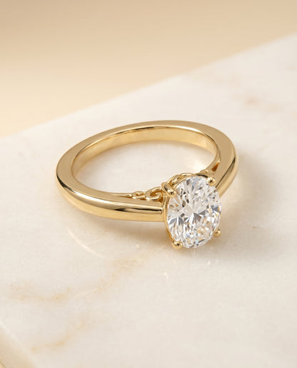 Rio Select Solitaire Oval Lab Diamond Engagement Ring in 18K Yellow Gold, shown on hand, angled | RockHer