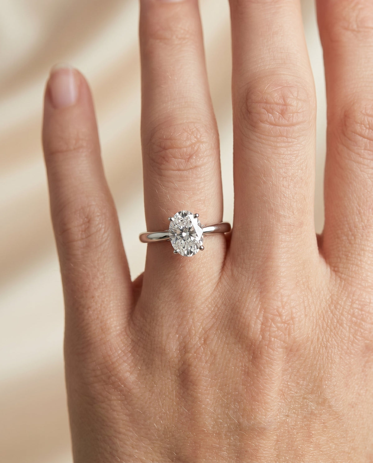 Rio Select Solitaire Oval Lab Diamond Engagement Ring in Platinum, shown on hand | RockHer
