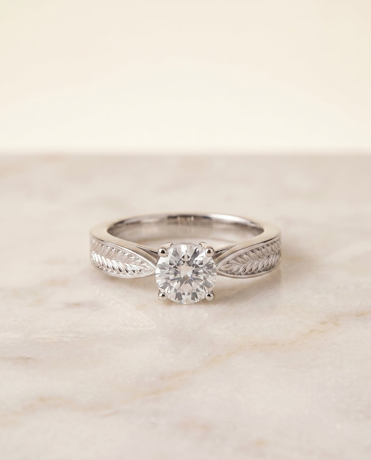 Roberta Select Solitaire Cushion Cut Lab Diamond Engagement Ring in 18K White Gold, shown on hand, angled | RockHer