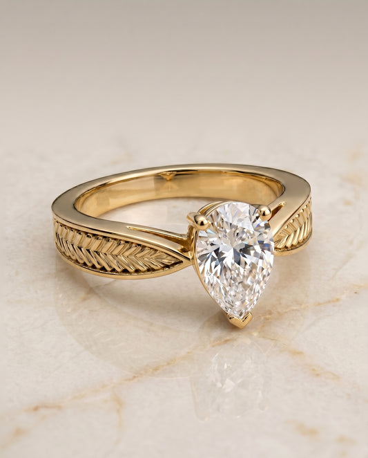 The Roberta Solitaire Engagement Ring Setting for Pear Diamonds in 18K Yellow Gold