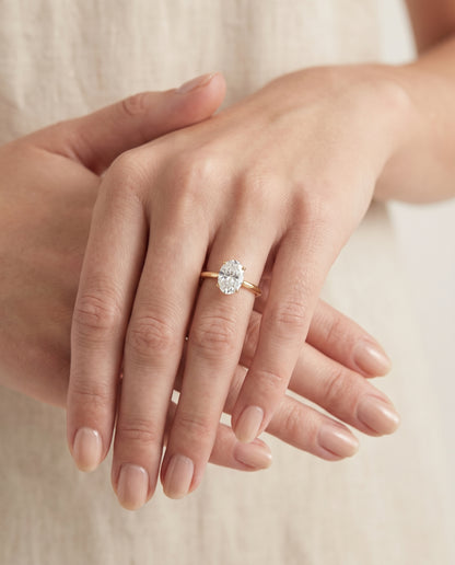 The Rosanna Cathedral Surprise Stone Solitaire Oval Engagement Ring Setting in 18K Yellow Gold