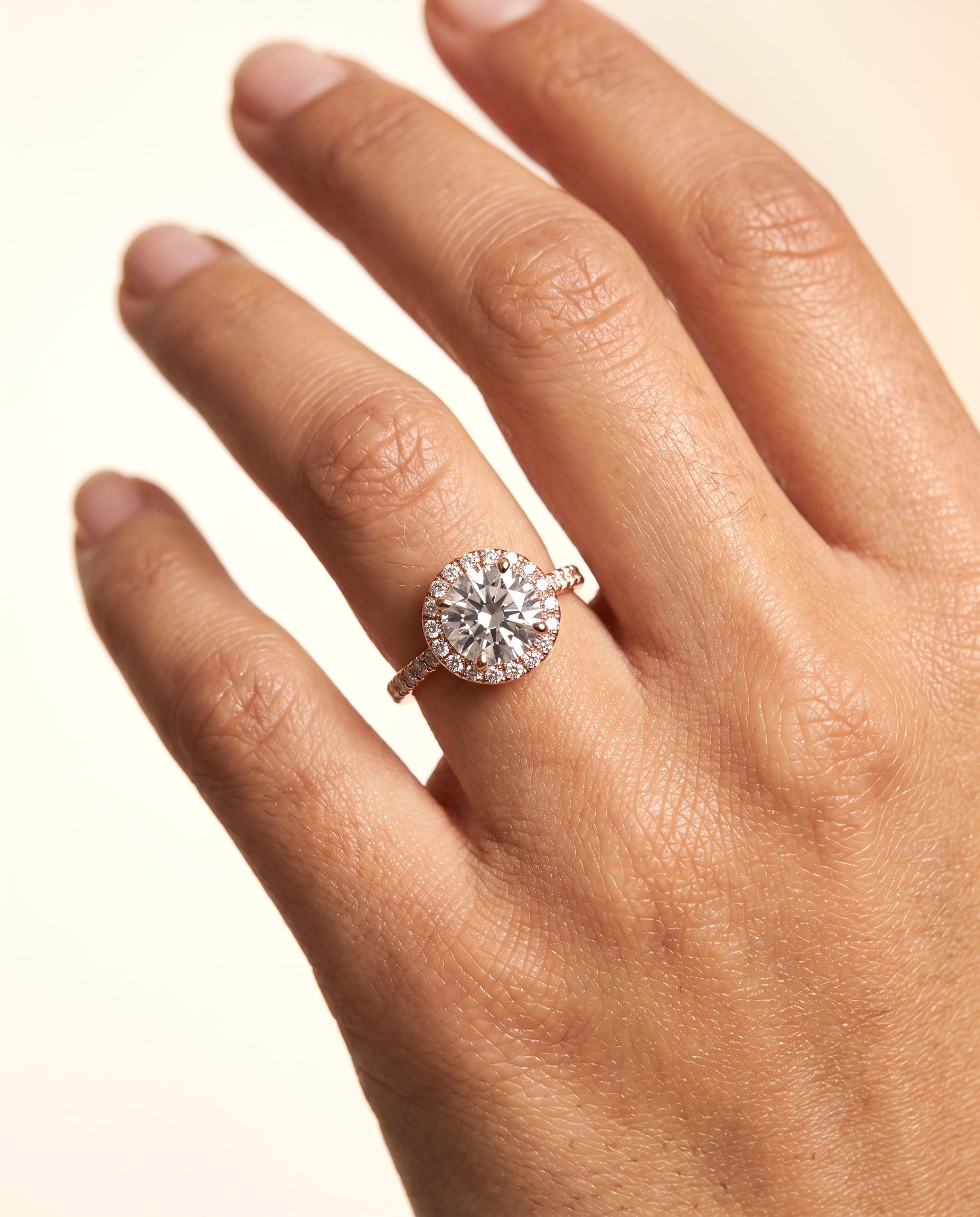 The Sade engagement ring setting in 14K Rose Gold, classic french pavé halo linear design | RockHer