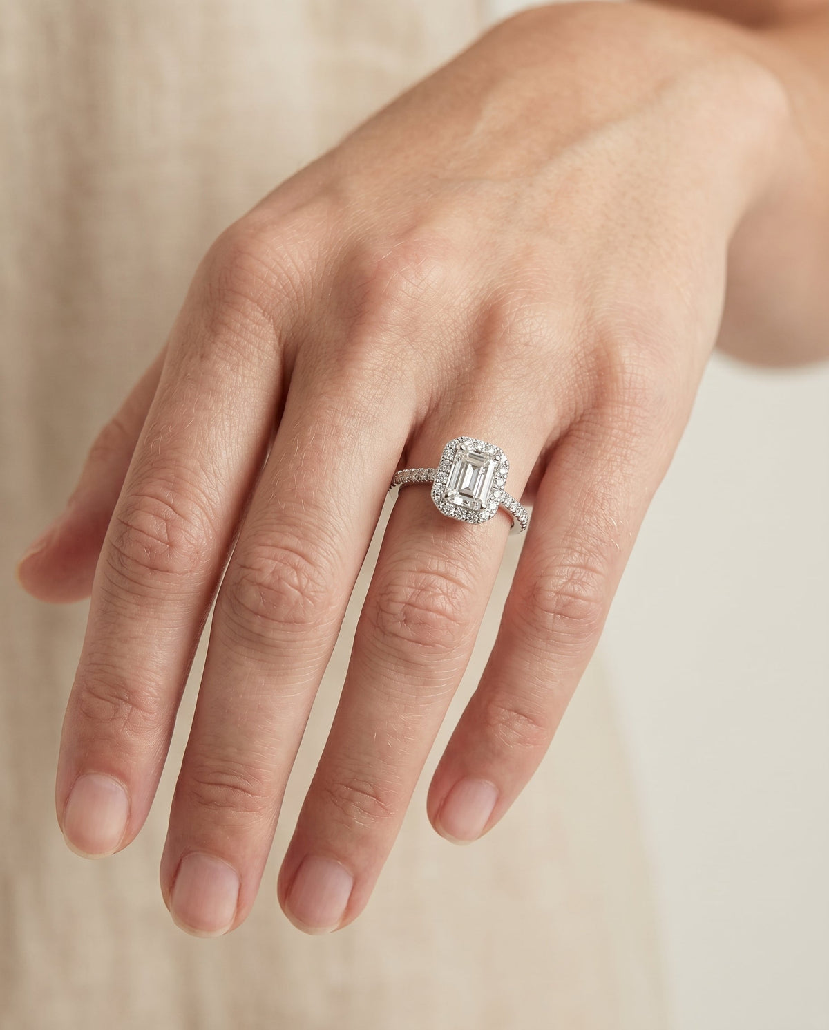 Sade Select Halo Emerald Cut Lab Diamond Engagement Ring in 18K White Gold, shown on hand | RockHer