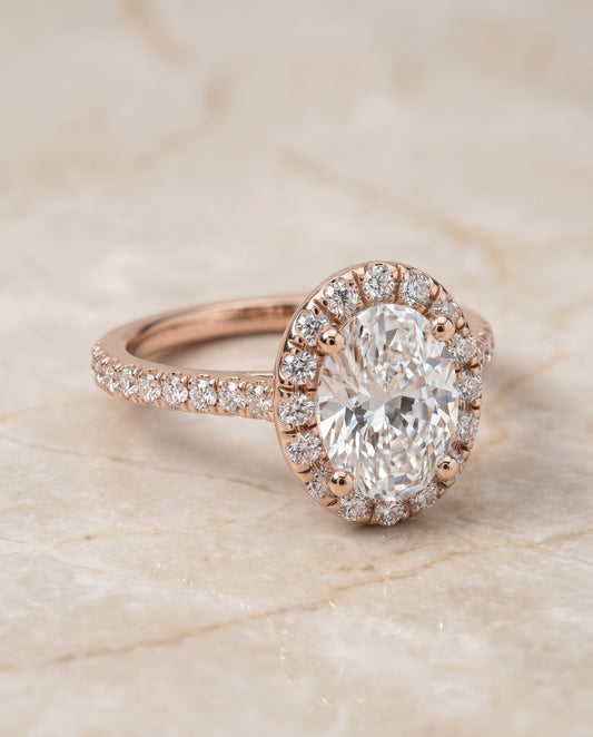 The Sade Halo Engagement Ring Setting for Oval Diamonds in 14K Rose Gold