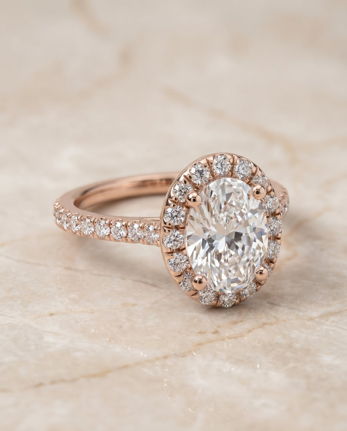 Sade Select Halo Oval Lab Diamond Engagement Ring in 14K Rose Gold, shown on hand, angled | RockHer