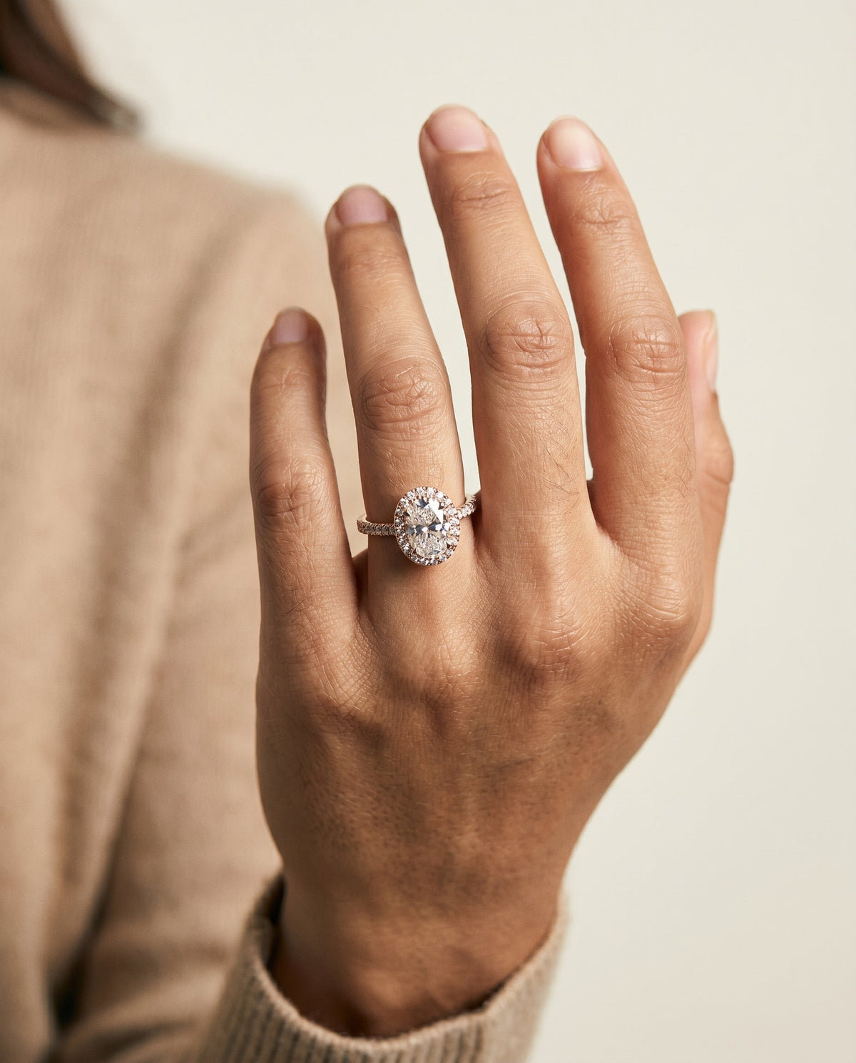 Sade Select Halo Oval Lab Diamond Engagement Ring in 14K Rose Gold, shown on hand | RockHer