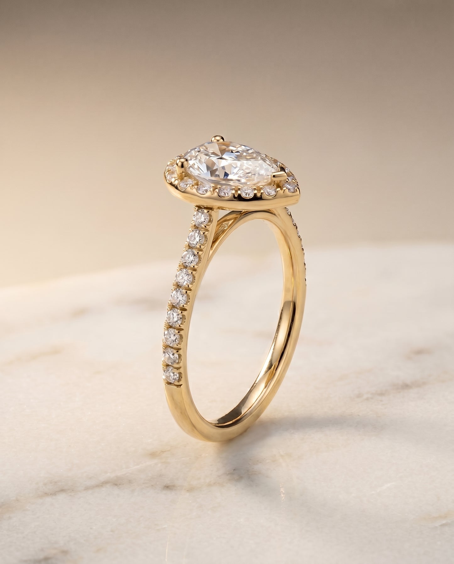 The Sade Classic French Pavé Halo Linear Pear Engagement Ring Setting in 18K Yellow Gold