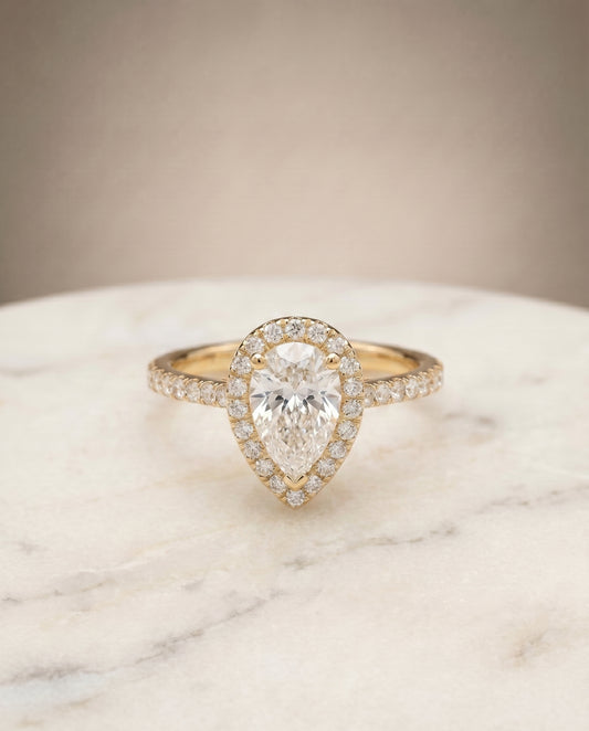 The Sade Halo Engagement Ring Setting for Pear Diamonds in 18K Yellow Gold