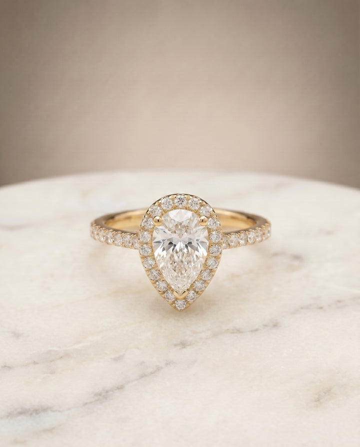 The Sade Classic French Pavé Halo Linear Pear Engagement Ring Setting in 18K Yellow Gold