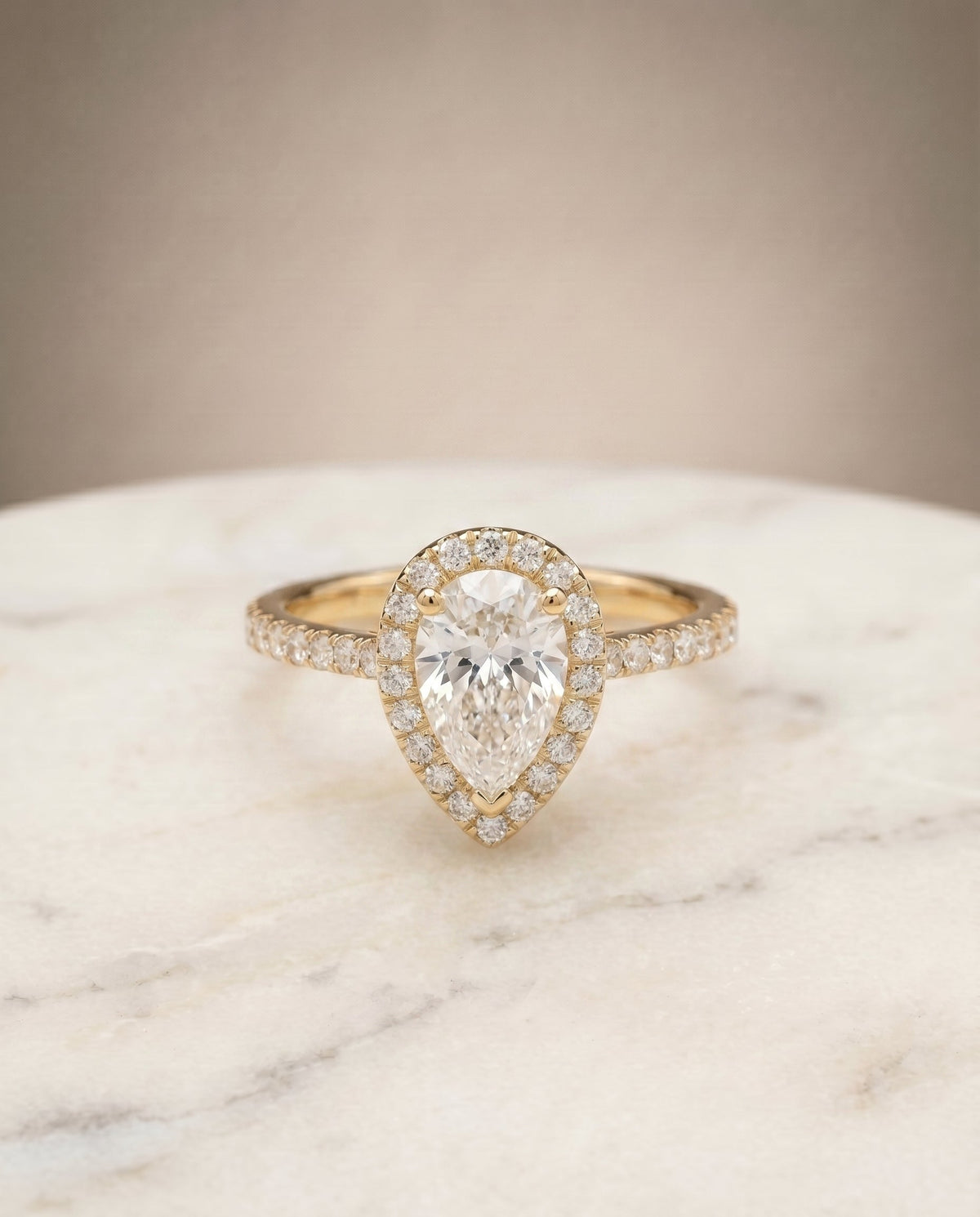 Sade Select Halo Pear Lab Diamond Engagement Ring in 18K Yellow Gold, shown on hand, angled | RockHer