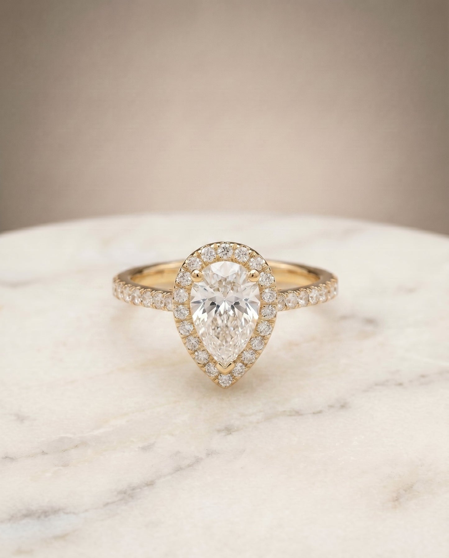 Sade Select Halo Pear Lab Diamond Engagement Ring in 18K Yellow Gold, shown on hand, angled | RockHer