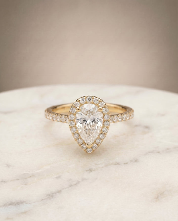 Sade Select Halo Pear Lab Diamond Engagement Ring in 18K Yellow Gold, shown on hand, angled | RockHer