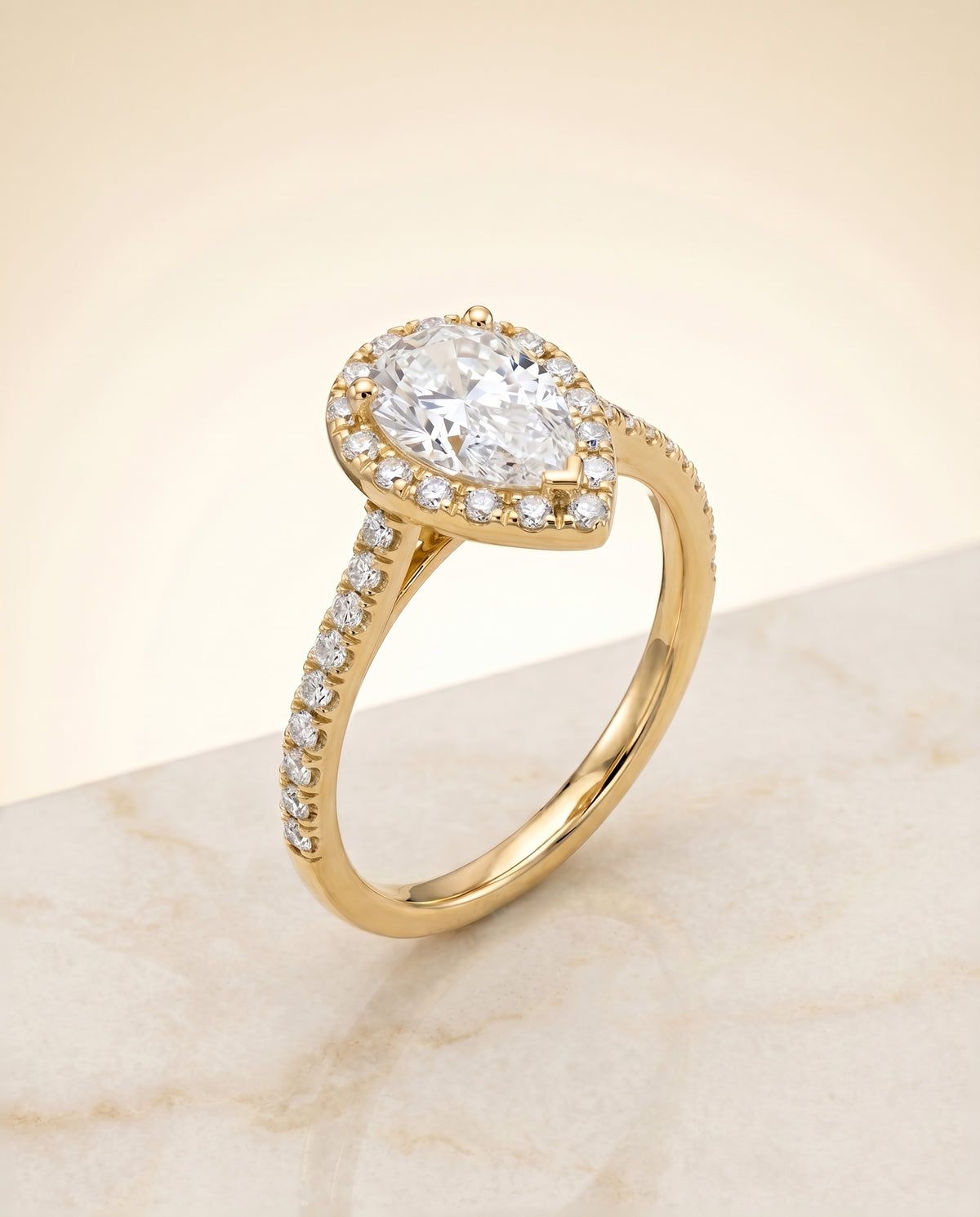 Classic French Pavé Halo Linear styling on The Sade pear engagement ring setting | RockHer