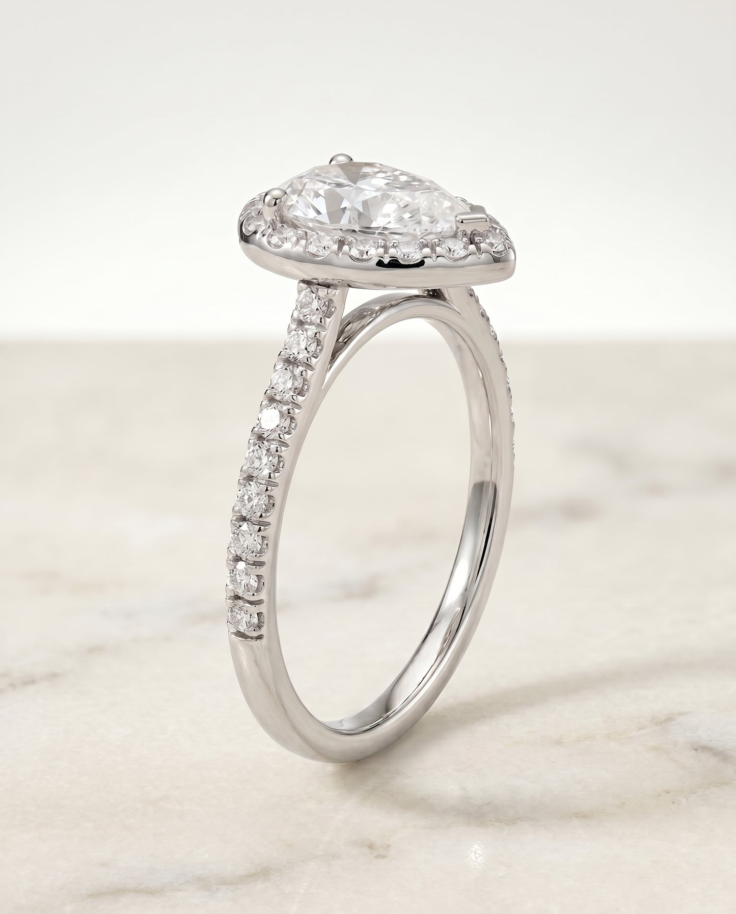 The Sade Classic French Pavé Halo Linear Pear Engagement Ring Setting in Platinum
