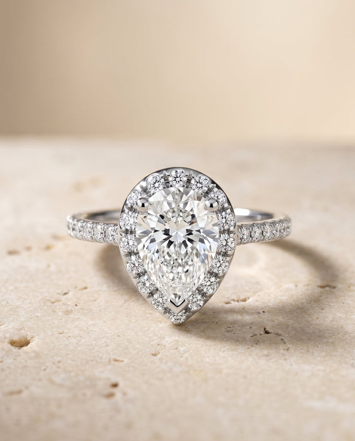 Sade Select Halo Pear Lab Diamond Engagement Ring in 18K White Gold, shown on hand, angled | RockHer