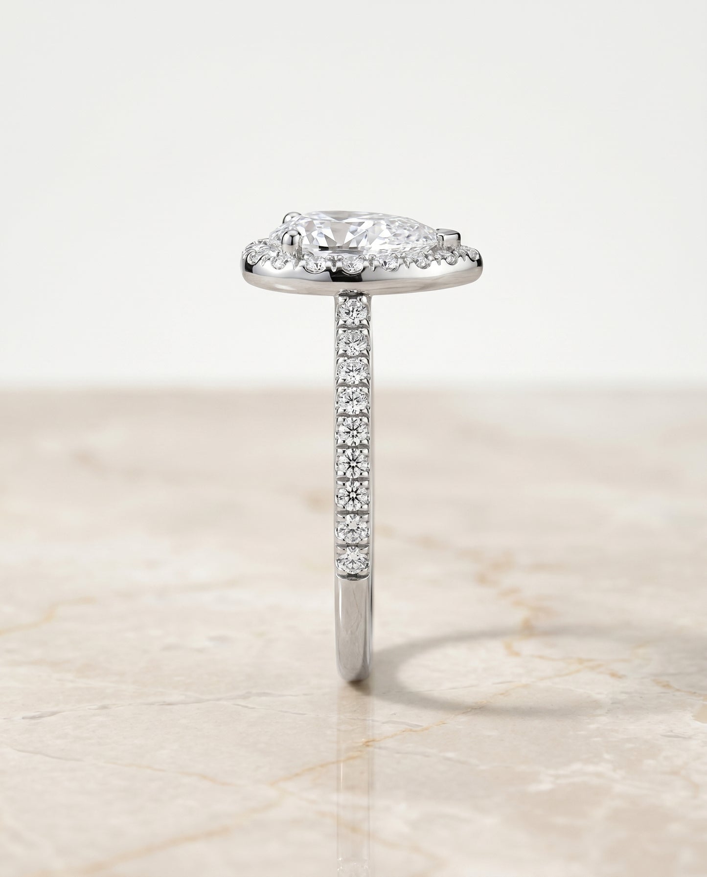 The Sade Classic French Pavé Halo Linear Pear Engagement Ring Setting in Platinum