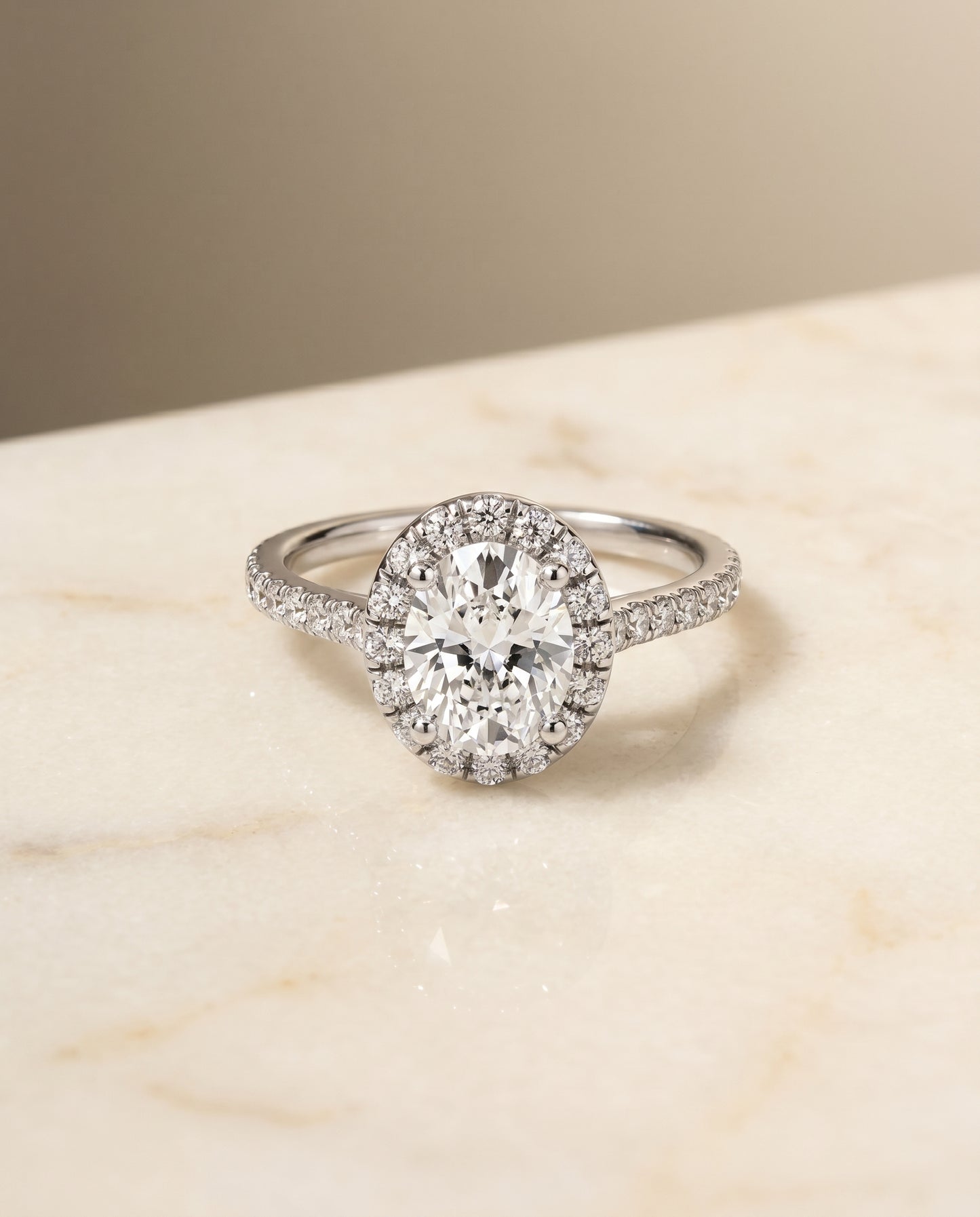 The Sade Pavé Halo Engagement Ring Setting for Oval Diamonds in 18K White Gold
