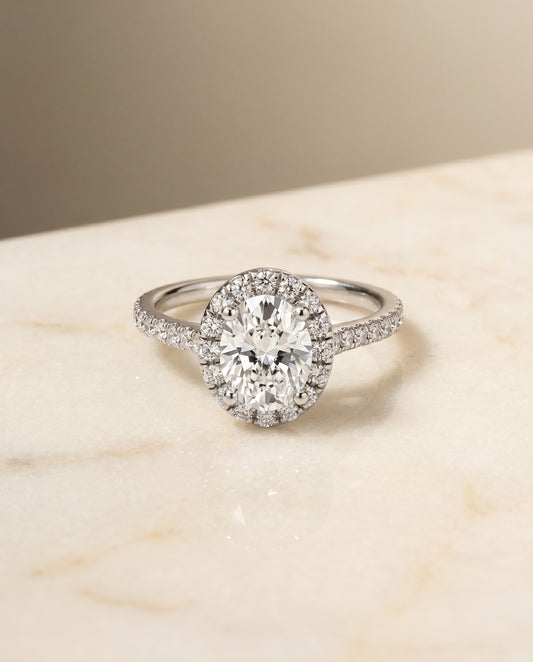 The Sade Pavé Halo Engagement Ring Setting for Oval Diamonds in Platinum