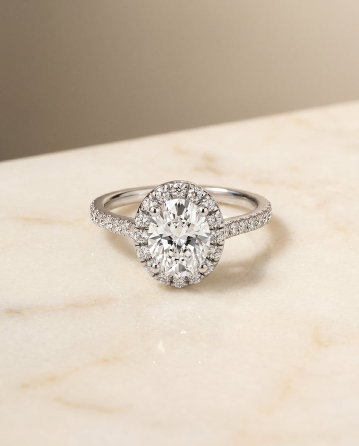 Sade Select Classic French Pavé Halo Linear Oval Lab Diamond Engagement Ring in 18K White Gold, shown on hand, angled | RockHer