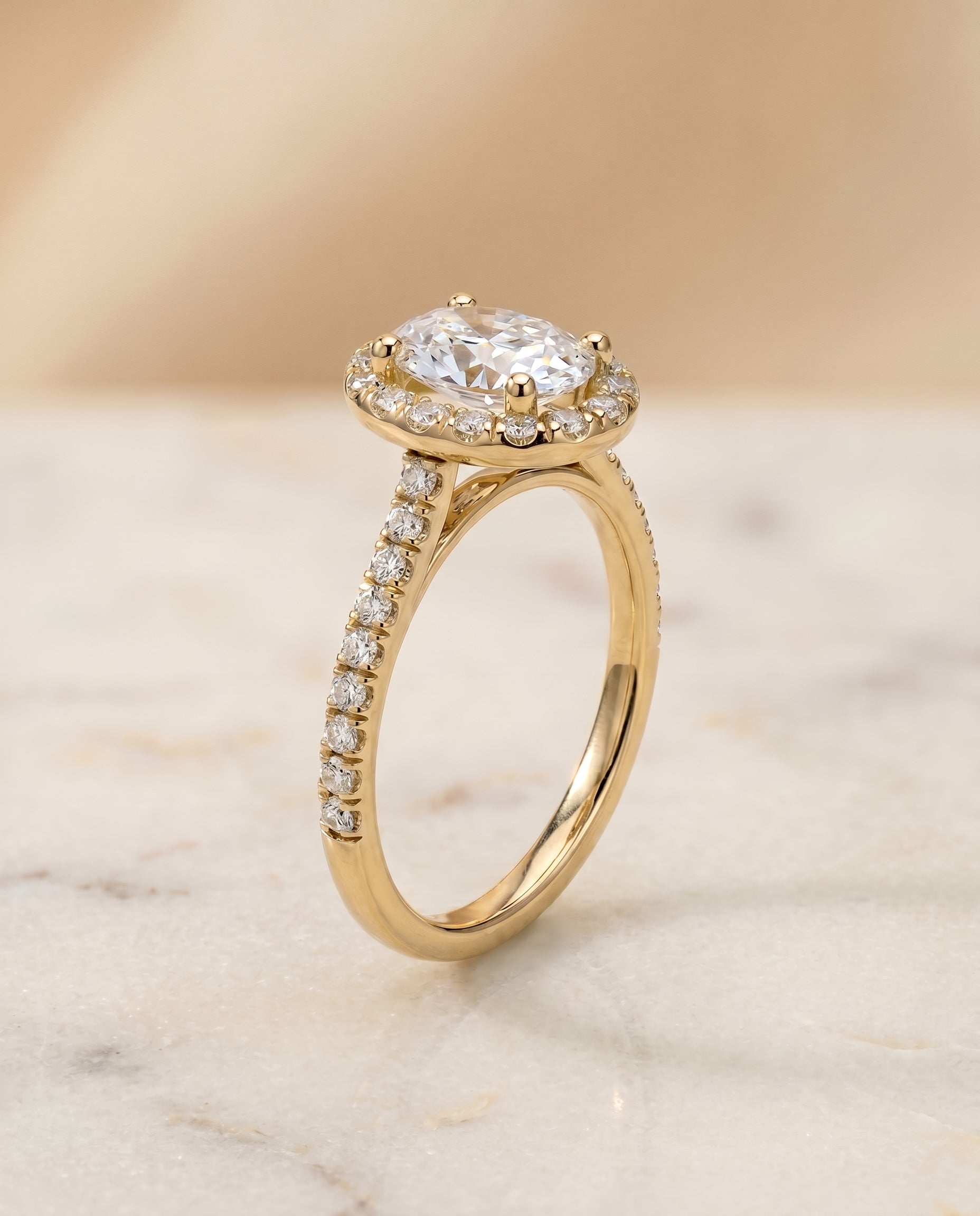 Sade Select Classic French Pavé Halo Linear Oval Lab Diamond Engagement Ring in 18K Yellow Gold, front view | RockHer