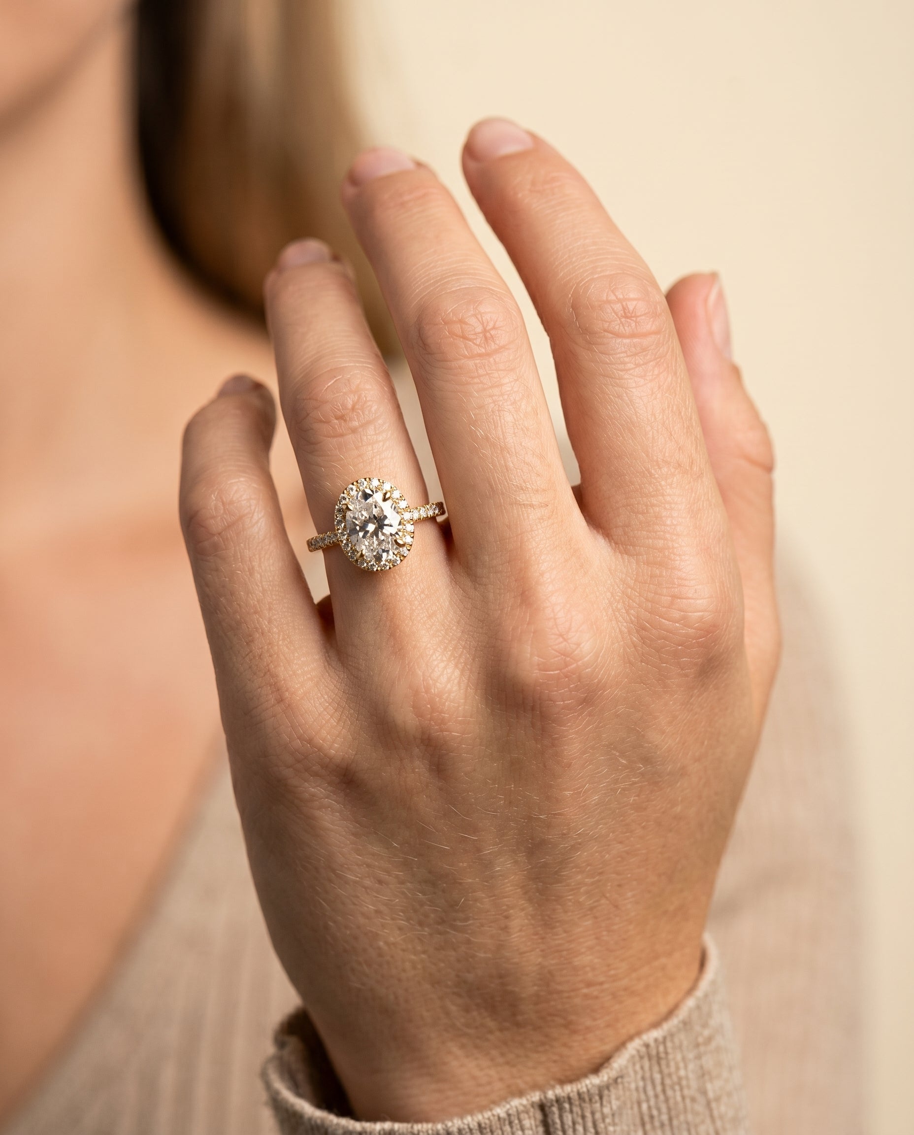 Sade Select Classic French Pavé Halo Linear Oval Lab Diamond Engagement Ring in 18K Yellow Gold, shown on hand | RockHer