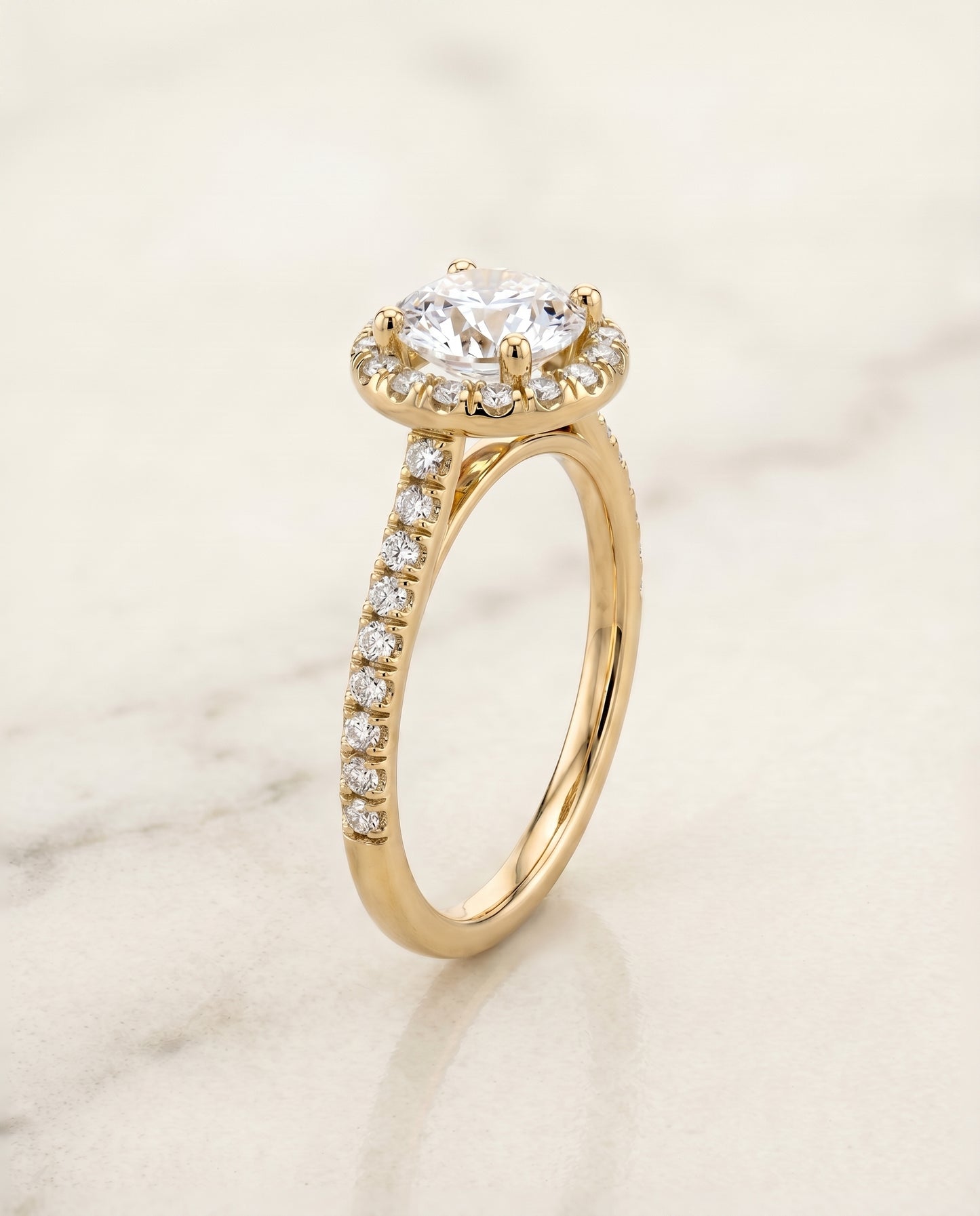 The Sade Pavé Halo Engagement Ring Setting for Round Diamonds in 18K Yellow Gold
