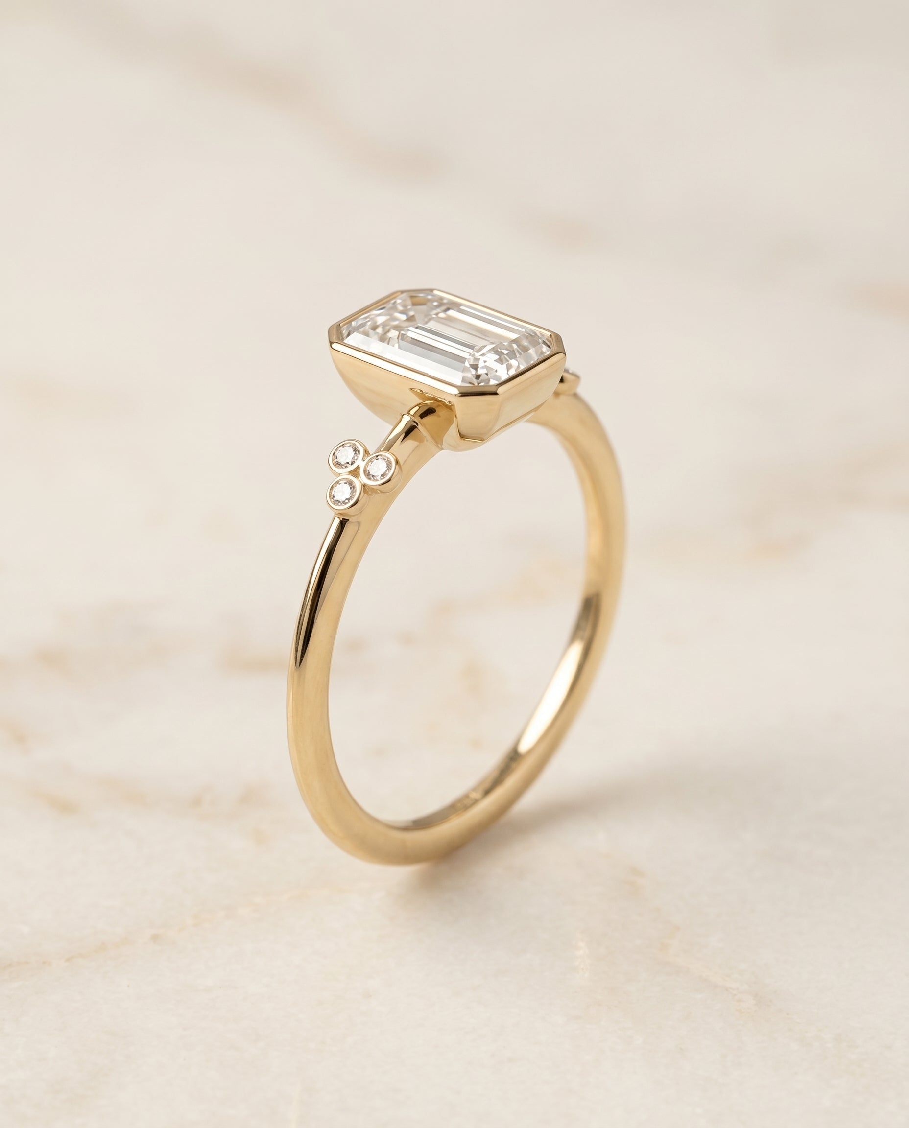 Clover Bezel Accent Solitaire Cut styling on The Selena emerald engagement ring setting | RockHer
