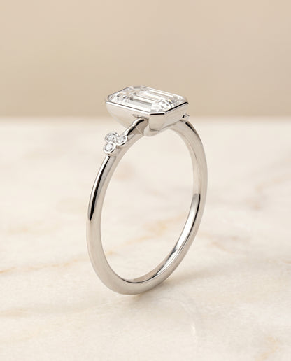 The Selena Clover Bezel Accent Solitaire Emerald Cut Engagement Ring Setting in Platinum