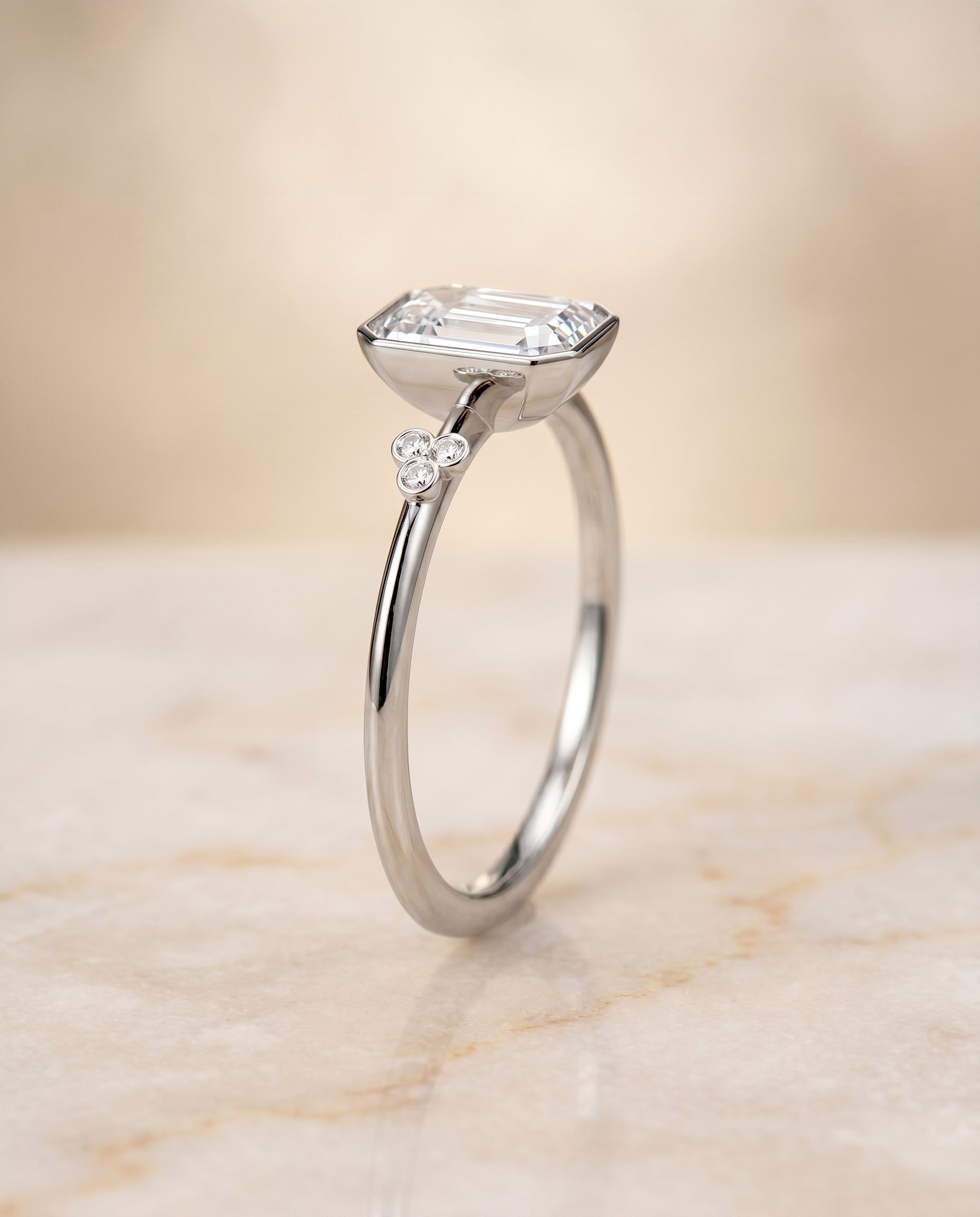 Clover Bezel Accent Solitaire Cut styling on The Selena emerald engagement ring setting | RockHer