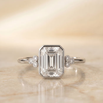 The Selena Clover Bezel Accent Solitaire Emerald Cut Engagement Ring Setting in 18K White Gold