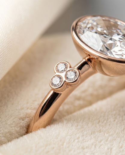 The Selena Clover Bezel Accent Solitaire Oval Engagement Ring Setting in 14K Rose Gold