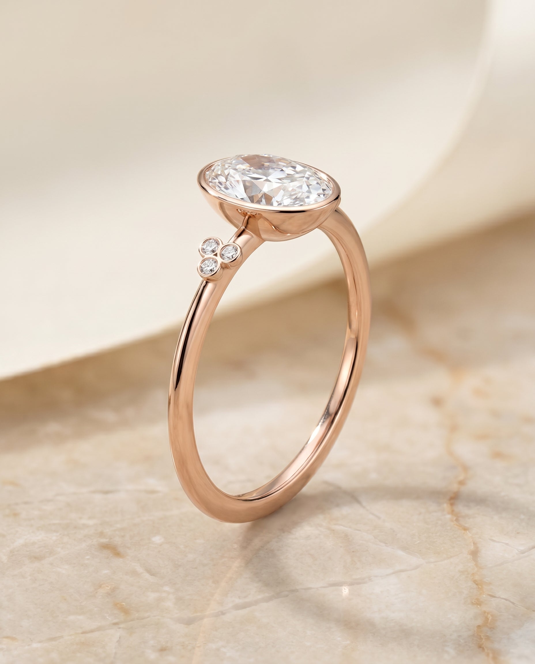 Clover Bezel Accent Solitaire styling on The Selena oval engagement ring setting | RockHer