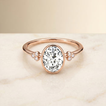 The Selena Clover Bezel Accent Solitaire Oval Engagement Ring Setting in 14K Rose Gold