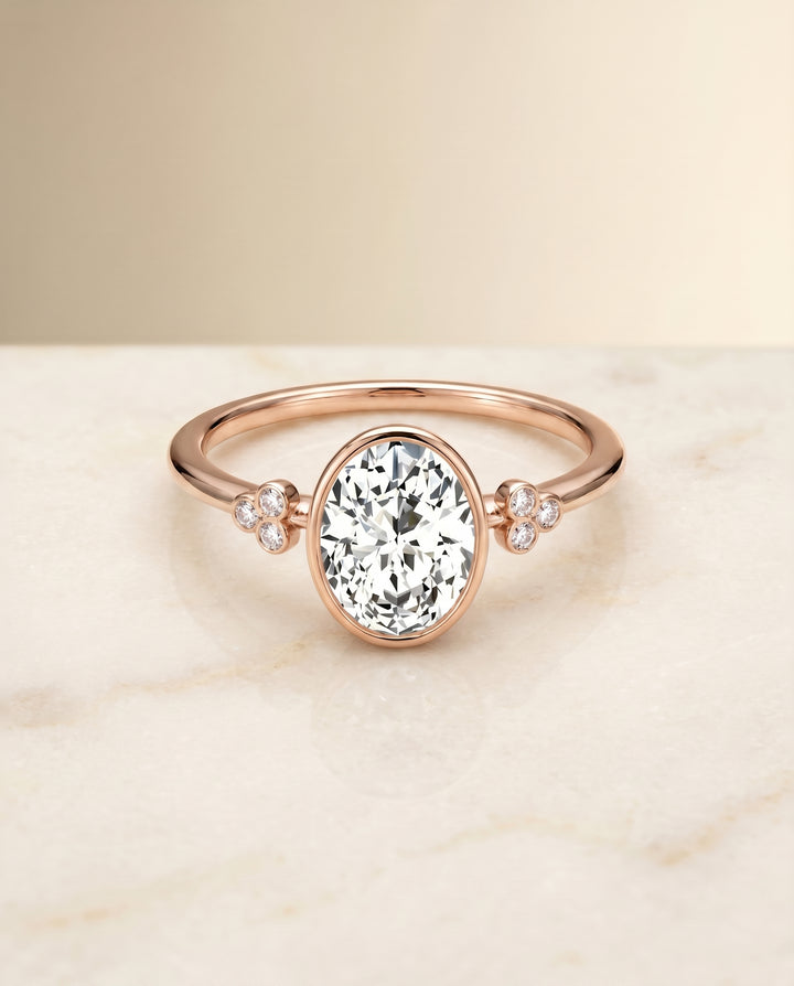 The Selena Clover Bezel Accent Solitaire Oval Engagement Ring Setting in 14K Rose Gold