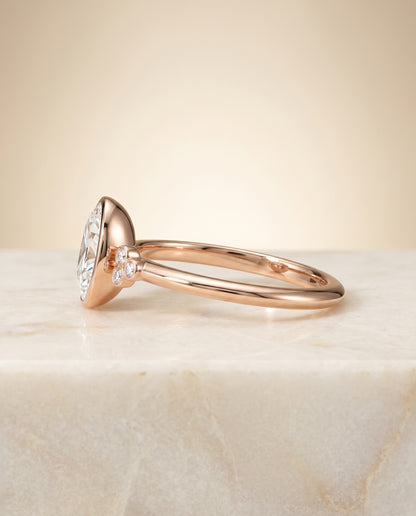 The Selena Clover Bezel Accent Solitaire Oval Engagement Ring Setting in 14K Rose Gold