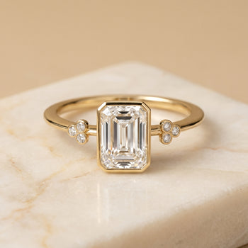 The Selena Clover Bezel Accent Solitaire Radiant Cut Engagement Ring Setting in 18K Yellow Gold