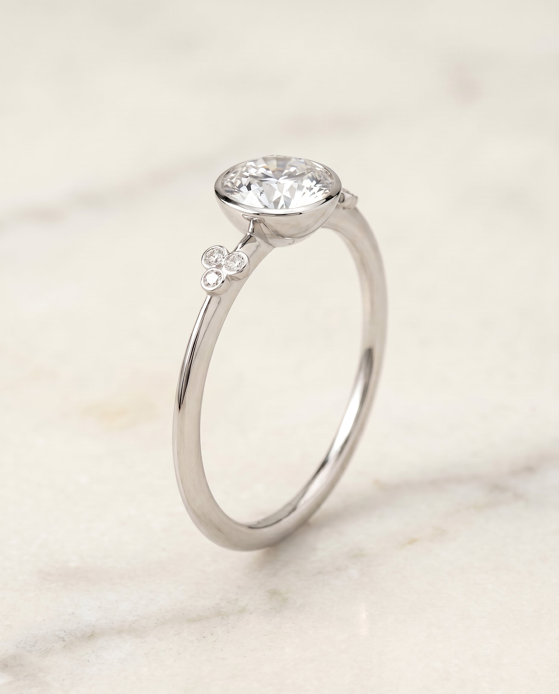 Clover Bezel Accent Solitaire styling on The Selena round engagement ring setting | RockHer