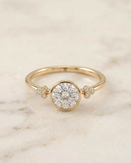 The Selena Bezel Solitaire Engagement Ring Setting for Round Diamonds in 18K Yellow Gold