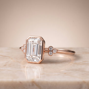 The Selena Clover Bezel Accent Solitaire Emerald Cut Engagement Ring Setting in 14K Rose Gold