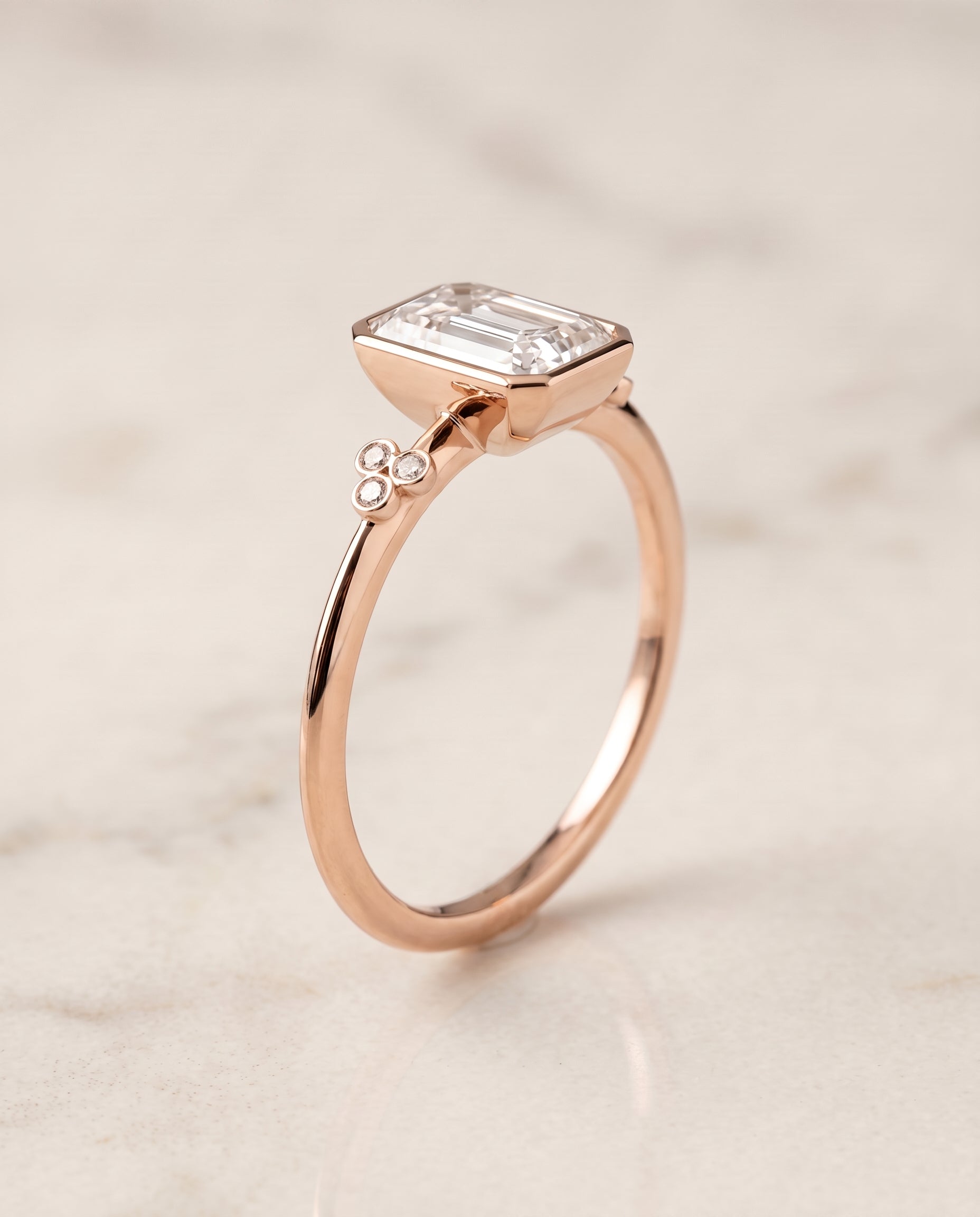 The Selena Clover Bezel Accent Solitaire Radiant Cut Engagement Ring Setting in 14K Rose Gold