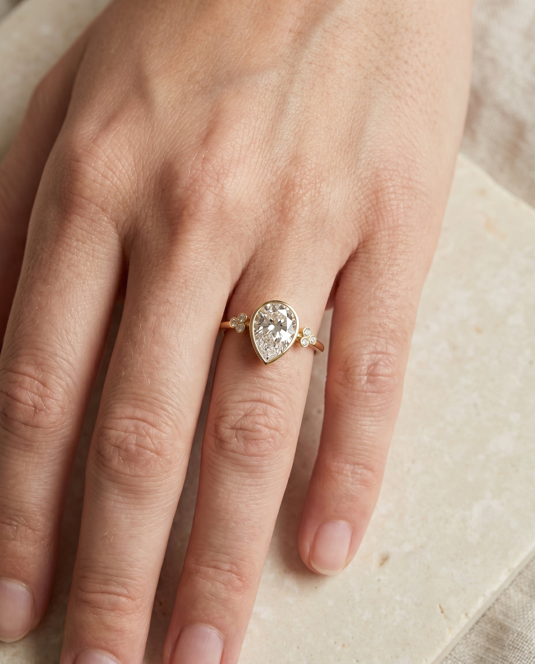 The Selena engagement ring setting in 18K Yellow Gold, clover bezel accent solitaire design | RockHer